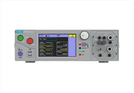 Vitrek electrical testing instrument with digital display and multiple test terminals.